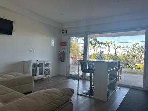 a living room with a couch and a table at Quinta da Mainça in Coimbra