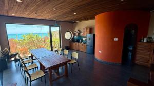 a kitchen and dining room with a table and chairs at Phuongvilla Đông Hải in Thôn Ðông Giang