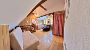 a living room with a couch and a chair at Sekin Vinograd in Voloder +17 photos