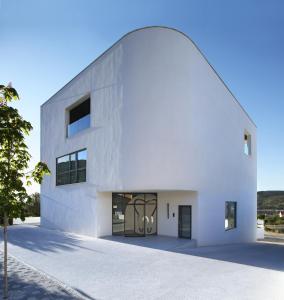 a white building with an archway at Trogir SkyView Suites in Trogir