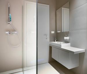 a white bathroom with a sink and a shower at Trogir SkyView Suites in Trogir +52 photos
