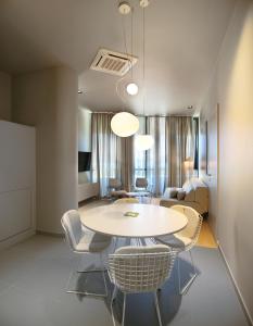 a dining room with a table and chairs at Trogir SkyView Suites in Trogir
