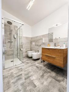 a bathroom with a shower and a sink and a tub at Natur Hotel Tanca in Cardedu +35 photos