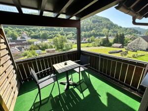 a balcony with a table and chairs and a view at Hotel Gasthaus Stern in Nusplingen