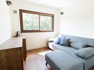 a living room with a couch and a window at Locanda Furanora in Furano +48 photos