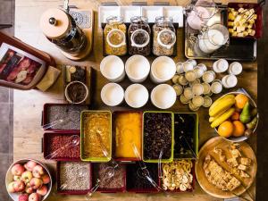 a table topped with different types of food and drinks at ibis Vilnius Centre in Vilnius