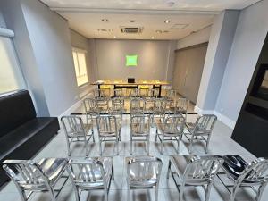 a conference room with a table and chairs at ibis Styles Boa Vista in Boa Vista