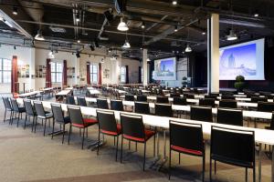 a large room with rows of tables and chairs at Solo Sokos Hotel Torni Tampere in Tampere