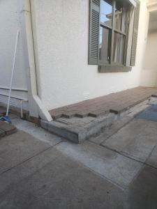 a set of stairs leading to a window on a building at Entire Unit in Brooklyn Park in West Richmond +1 photo