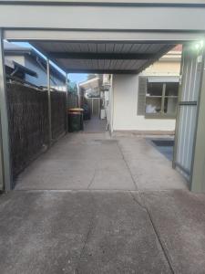 an entrance to a building with a garage at Entire Unit in Brooklyn Park in West Richmond