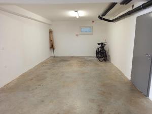 a room with a bike parked in the wall at Apartments Luna in Malinska
