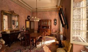 a dining room with a table and a mirror at Albergo dell'Angelo in Pieve di Teco