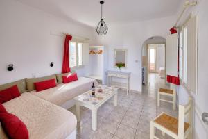 a living room with a couch and a table at Marili Apartments Studios in Parasporos
