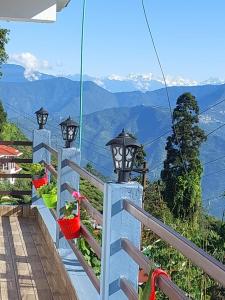 a view of the mountains from the balcony of a house at grace homestay in Darjeeling +6 photos