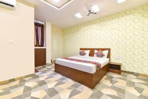 a bedroom with a bed in a room at FabHotel Shivalika in Jaipur +26 photos
