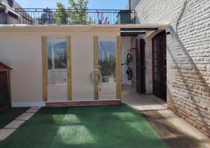 a house with a green lawn in front of a door at Gaillarde in Brive-la-Gaillarde