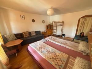 a living room with a couch and a table at Guesthouse Nina in Sarajevo