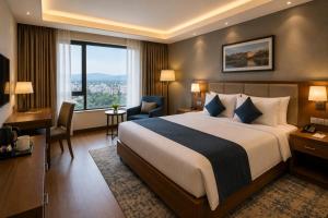 a hotel room with a bed and a large window at Green Villa in Nagpur