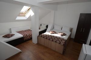 a room with two beds and a window at Ionela in Costinesti