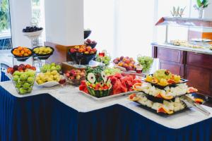 a buffet of fruits and vegetables on a table at Sun Palace Hotel - All Inclusive in Sunny Beach