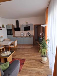 a living room with a couch and a table at Achterwasser Blick in Ueckeritz