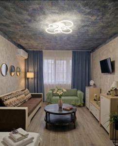 a living room with a couch and a table at Old City Cafe in Brăila