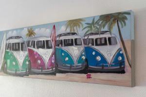 a painting of four vans parked on the beach at AppartHotel le Nid Marin in Aytré +11 photos