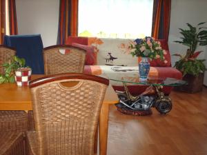 a dining room with a table and a motorcycle on it at Le réveil des oiseaux in Saint-Michel +14 photos