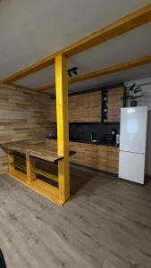 a kitchen with a table and a refrigerator at HIT- house in Slavske