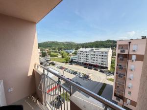 a balcony of a building with a view of a street at Apartment Alto in Sarajevo