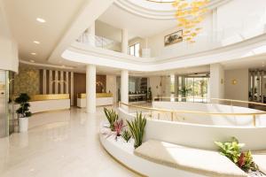 a large lobby with a large white building with a ceiling at Vantaris Palace in Georgioupolis +270 photos