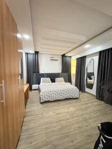 a bedroom with two beds in a room at Executive Apartment in Anthony in Lagos
