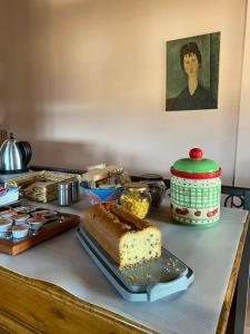 a table topped with a piece of cake and other food at B&B LA ROSA in Salerno