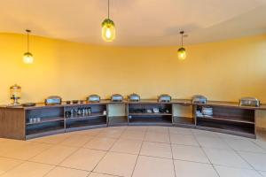 a large waiting room with a row of machines at Treebo Kaler Hotel & Resorts in Nainital