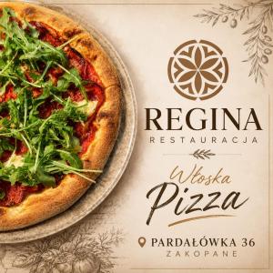a pizza sitting on top of a table at Willa Regina I Resort & SPA in Zakopane +146 photos