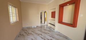 a hallway with a marble floor and a mirror at Murugan Kudil in Mudukarai