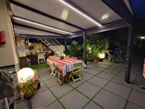 a patio with a table and chairs on it at Pavillon de Diane in Prades