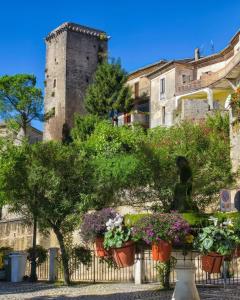 a castle and some flowers inront of a fence at Belvedere da Fernanda in Fontechiari