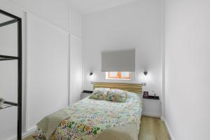 a small bedroom with a bed and a mirror at Villa Jomeca in Salobre +67 photos