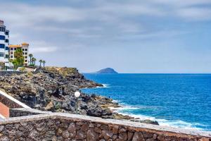a view of the ocean from a cliff at Atlantic Penthouse Retreat in Costa Del Silencio