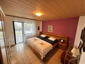 a bedroom with a large bed in a room at Apartment Bepo in Senj