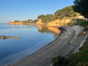a view of a beach next to the water at Casa Lluna De Mar in L'Ampolla