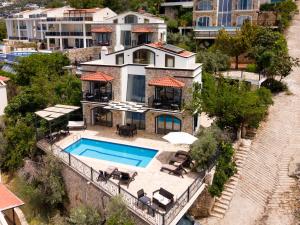 an aerial view of a house with a swimming pool at Villa Meltem in Kalkan