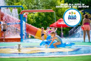 a child on a raft in a water park at AQUA HOUSE in Sopot