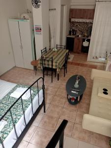 a living room with two bunk beds and a table at Studio Panagiota in Kavála