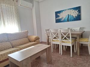 a living room with a couch and a table at Apartamento Sevilla 3 in La Guardia
