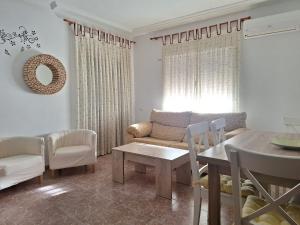 a living room with a couch and a table at Apartamento Sevilla 3 in La Guardia