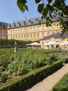 a large building with a garden in front of it at Fewo Sand 10 - Altstadtsuite in Bamberg