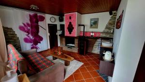 a living room with a couch and a fireplace at Ca'Neggio in Neggio