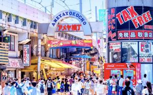 a crowd of people walking through a busy city street at -Park Higashiueno301- 4-minute walk from Ueno Station in Tokyo